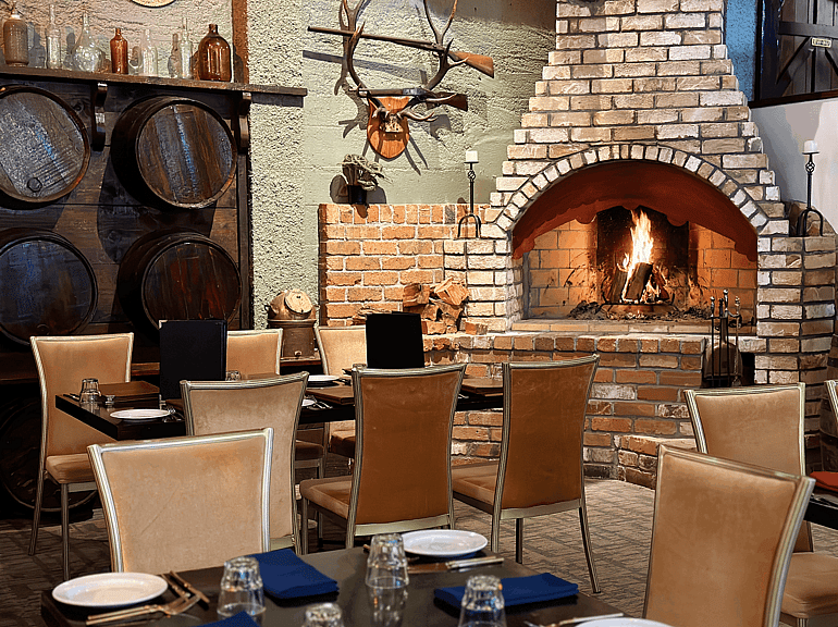 Fireside dining at Game Keepers Restaurant in Waimauku