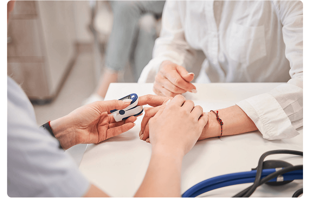 Healthcare worker checking a patient's blood pressure