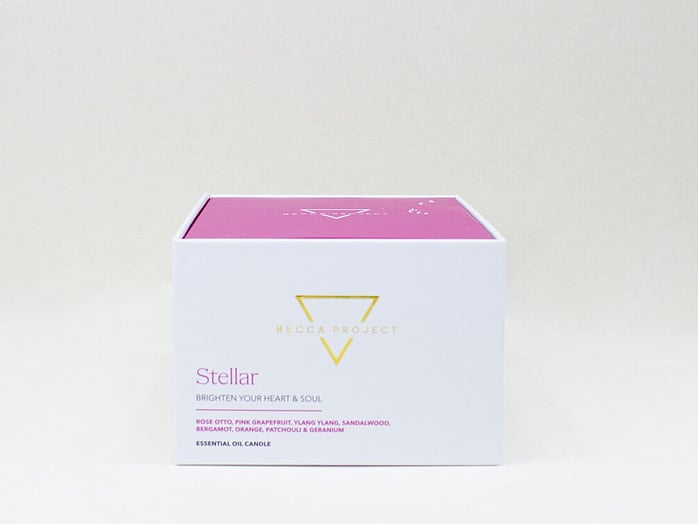 Close-up of Becca Project luxury body care products featured in a curated gift box.