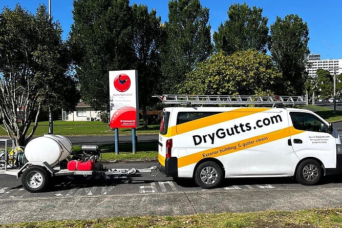 DryGutts van with equipment for soft washing exterior house cleaning