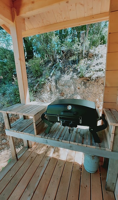 private deck at Tawa Cove Cabins with BBQ