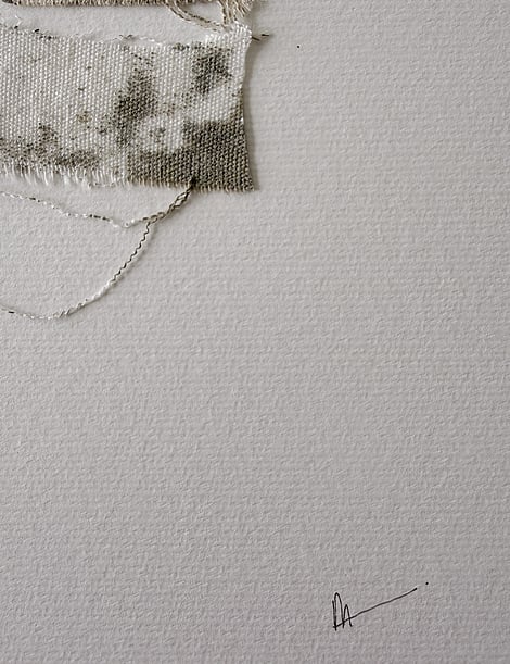 close-up image of ivory fabriano surface texture, layered cotton fragments blotted with green-grey acrylic, soft frayed edges and handwritten signature in lower right corner