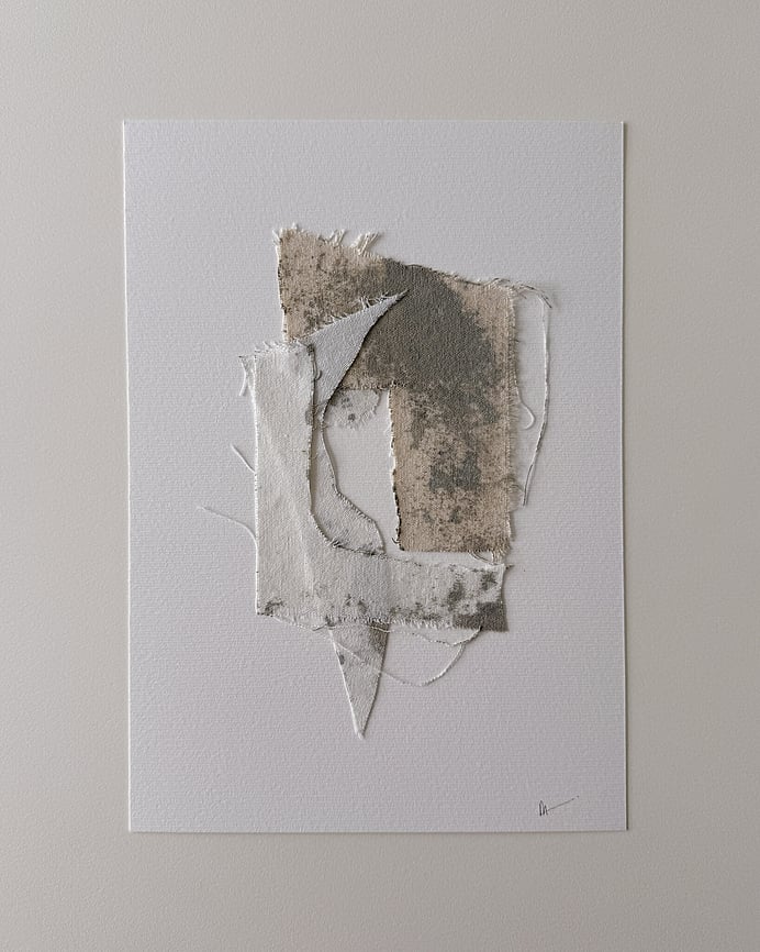 full image of a layered collage on soft white fabriano, showing repurposed pale cream cotton fragments blotted with green-grey acrylic, visible weave texture, soft frayed edges and handwritten signature in lower right corner 