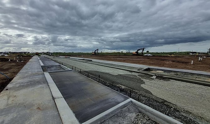 Stage 22 – nearing completion with concrete going down and sections being topsoiled