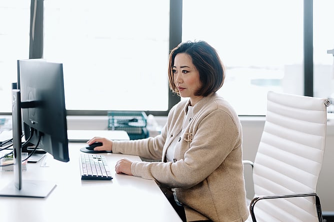 Woman working at a computer in an office setting