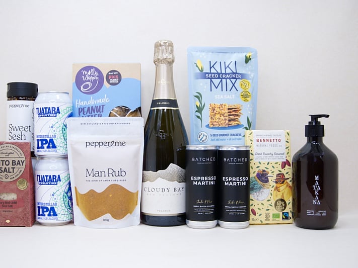 Welcome Home Gift Box with Cloudy Bay wine, espresso martinis, gourmet crackers, honey, artisan chocolate, hand wash, and New Zealand-made pantry favourites, beautifully packaged for housewarming and new home gifting.