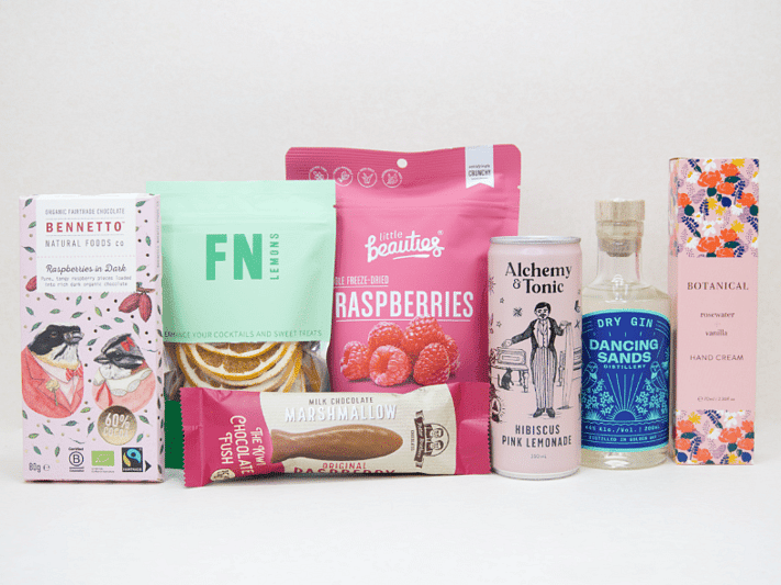 The Perfect G&T Gift Box featuring Dancing Sands Gin, Alchemy & Tonic Lemonade, Little Beauties freeze-dried raspberries, FN citrus garnishes, Botanicals Rosewater & Vanilla hand cream, Bennetto chocolate, and Potter Brothers chocolate fish, beautifully packaged for gin lovers and gifting.