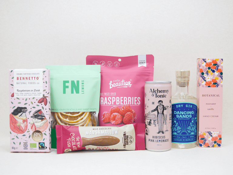 The Perfect G&T Gift Box featuring Dancing Sands Gin, Alchemy & Tonic Lemonade, Little Beauties freeze-dried raspberries, FN citrus garnishes, Botanicals Rosewater & Vanilla hand cream, Bennetto chocolate, and Potter Brothers chocolate fish, beautifully packaged for gin lovers and gifting.