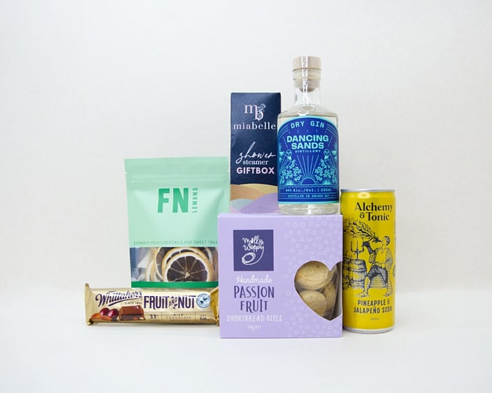 Gin Night In gift box with Dancing Sands gin, Molly Woppy cookies, Miabelle shower steamers, and FN dried lemons, thoughtfully packaged for gifting, relaxation, and gin lovers.