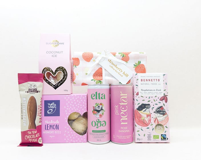 Pretty in Pink gift box with Nectar drink, Elta Ego products, Molly Woppy treats, Strawberry Hill tea towel, coconut ice, chocolate fish, and Bennetto chocolate, presented in a premium gift box