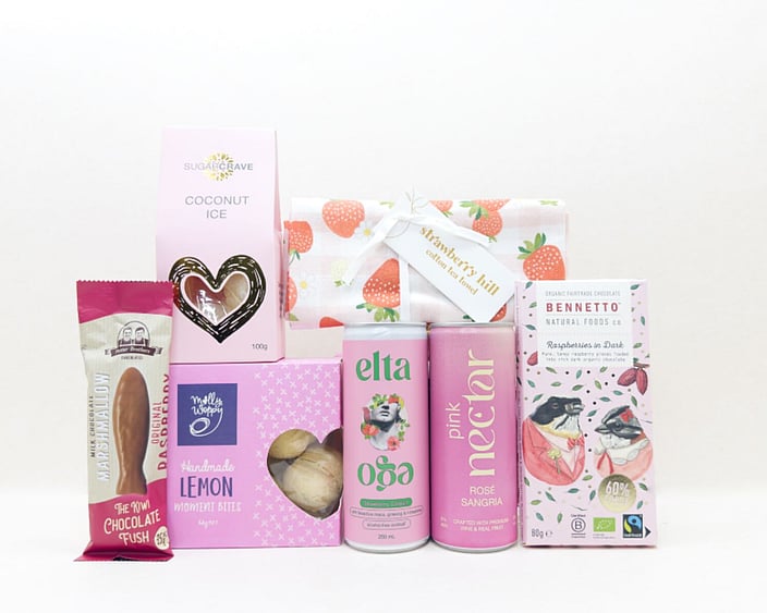 Pretty in Pink gift box with Nectar drink, Elta Ego products, Molly Woppy treats, Strawberry Hill tea towel, coconut ice, chocolate fish, and Bennetto chocolate, presented in a premium gift box