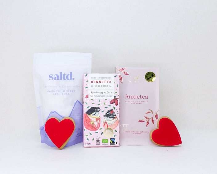 Rest & Restore self-care gift box featuring Anxietea tea, Saltd bath salts, Bennetto chocolate, and sweet treats, beautifully packaged for gifting.