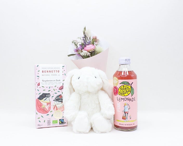 The Cute Gift Box featuring a cuddly teddy, dried flowers, artisan chocolate, and a refreshing Pete's Natural drink, beautifully packaged and ready to gift