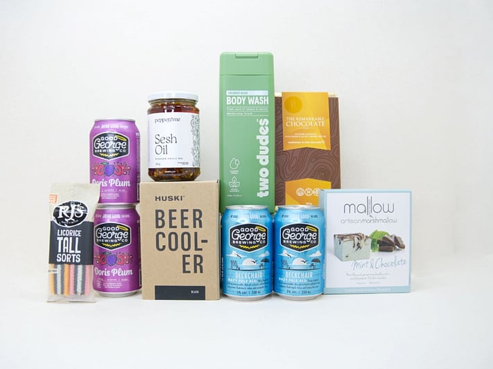 Spoil Him Gift Box featuring Good George beer, Two Dudes shower gel, Great Day Mallow treats, and a HUSKI beer cooler in a premium KYND gift box.