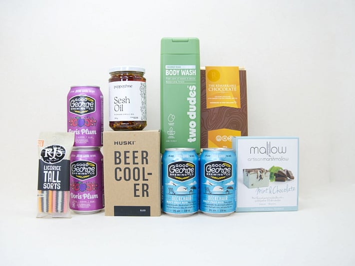 Spoil Him Gift Box featuring Good George beer, Two Dudes shower gel, Great Day Mallow treats, and a HUSKI beer cooler in a premium KYND gift box.