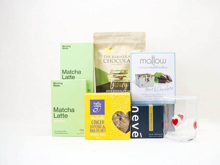 The Matcha Gift Box featuring Morning Made matcha, Molly Woppy biscotti, Nevé candle, HomeLab glassware, Great Day Mallow marshmallows, and Remarkable Chocolate in a premium KYND gift box.