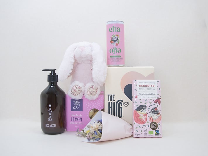 The New Mum Gift Box featuring The Hug tea, a soft teddy, Elta Ego products, Matakana Botanicals skincare, and Bennetto chocolate in a premium KYND gift box.