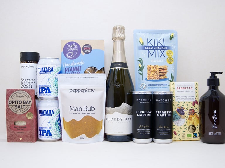 Welcome Home Gift Box with Cloudy Bay wine, espresso martinis, gourmet crackers, honey, artisan chocolate, hand wash, and New Zealand-made pantry favourites, beautifully packaged for housewarming and new home gifting.