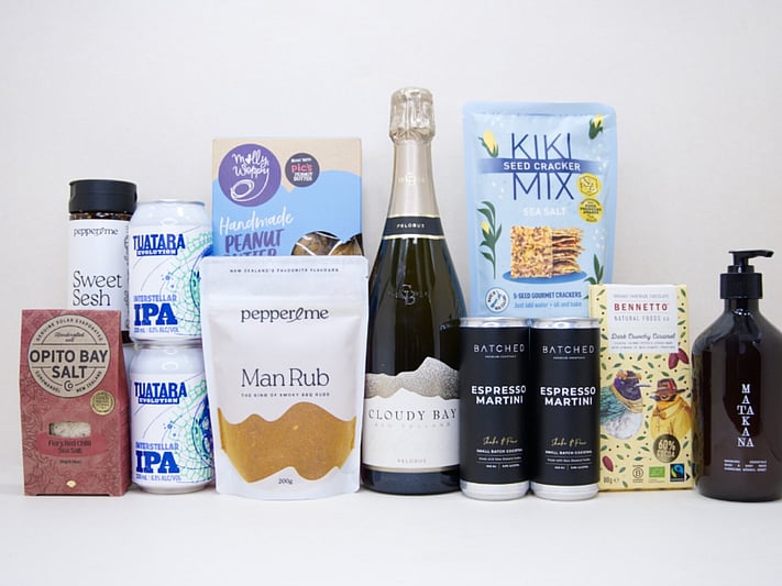 Welcome Home Gift Box with Cloudy Bay wine, espresso martinis, gourmet crackers, honey, artisan chocolate, hand wash, and New Zealand-made pantry favourites, beautifully packaged for housewarming and new home gifting.