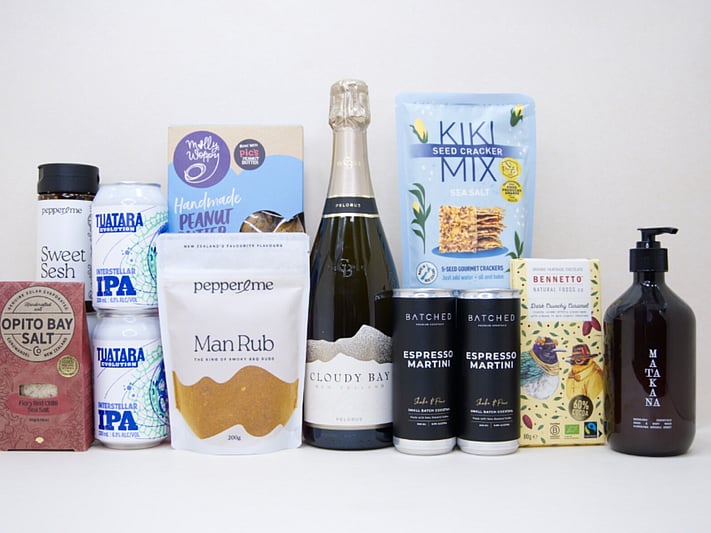 Welcome Home Gift Box with Cloudy Bay wine, espresso martinis, gourmet crackers, honey, artisan chocolate, hand wash, and New Zealand-made pantry favourites, beautifully packaged for housewarming and new home gifting.