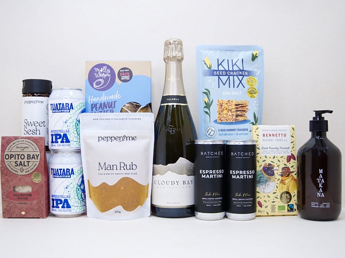 Welcome Home Gift Box with Cloudy Bay wine, espresso martinis, gourmet crackers, honey, artisan chocolate, hand wash, and New Zealand-made pantry favourites, beautifully packaged for housewarming and new home gifting.