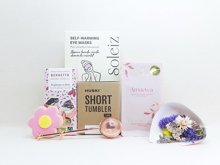With Sympathy Gift Box with Deco by D dried flowers, Anxietea tea, Soleiz eye masks, Bennetto chocolate, and Molly Woppy cookies, thoughtfully presented as a comforting gift during difficult times.