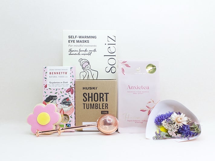 With Sympathy Gift Box with Deco by D dried flowers, Anxietea tea, Soleiz eye masks, Bennetto chocolate, and Molly Woppy cookies, thoughtfully presented as a comforting gift during difficult times.
