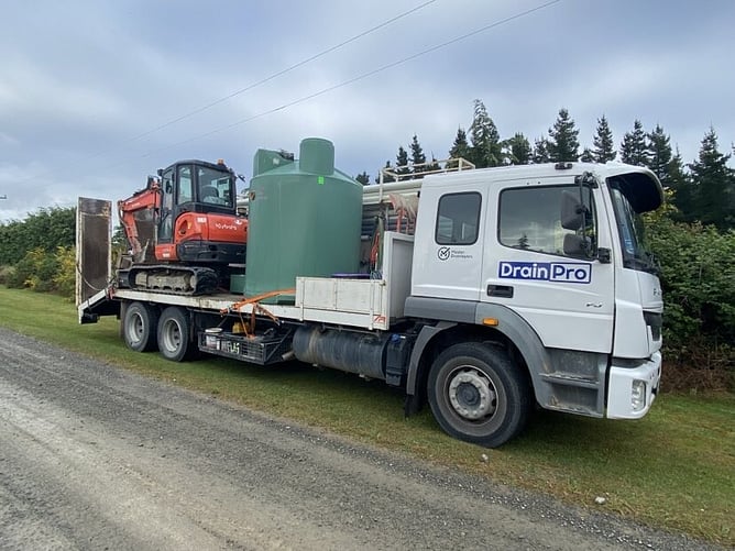 drainpro van carrying septic tank