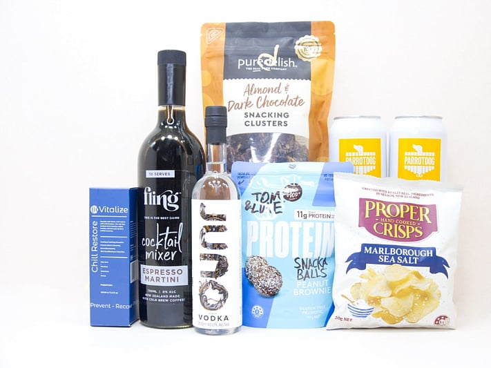Weekend Wind Down NZ gift box with Juno gin, Parrotdog craft beers, Fling espresso martini, Proper Crisps, Pure Delish snacks, Tom & Luke treats and Vitalize wellness products, beautifully packaged for gifting.