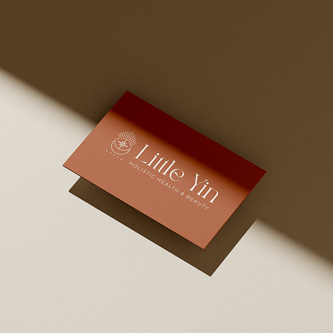 business card design showing a cohesive brand identity applied to printed marketing materials.