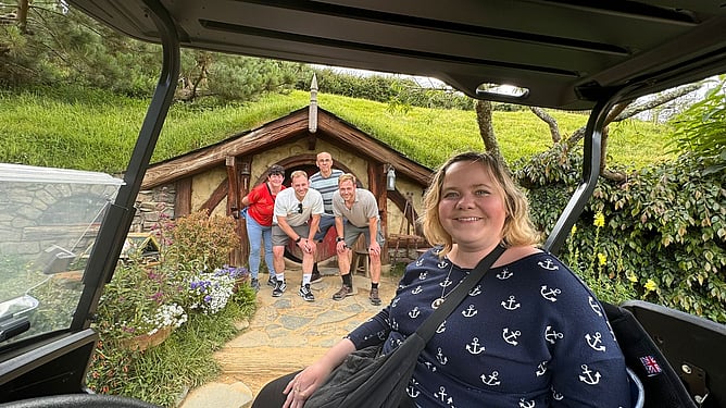 Ability Adventures guests visiting a hobbit hole at Hobbiton Movie Set, New Zealand