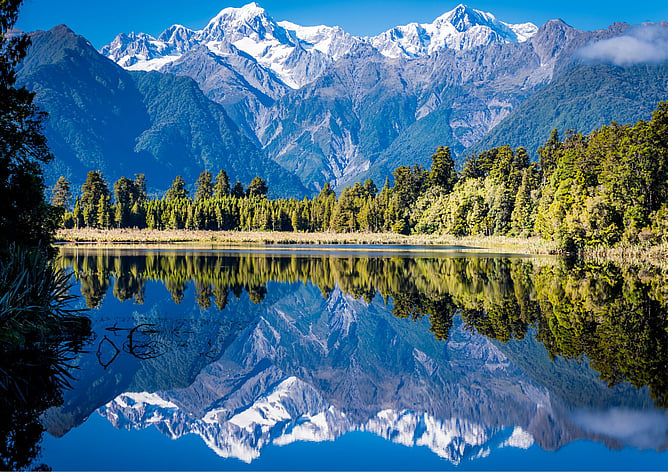 Aoraki Mount Cook reflected in Lake Matheson under clear skies, New Zealand