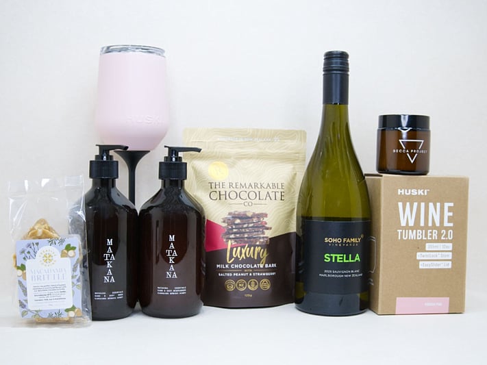 Thank You Gift Box featuring Stella Sauvignon Blanc, a HUSKI wine tumbler, Matakana Botanicals moisturiser and body wash, Remarkable strawberry luxury bark, and macadamia brittle, beautifully packaged to show appreciation and gratitude.