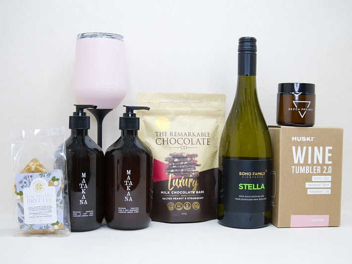 Thank You Gift Box featuring Stella Sauvignon Blanc, a HUSKI wine tumbler, Matakana Botanicals moisturiser and body wash, Remarkable strawberry luxury bark, and macadamia brittle, beautifully packaged to show appreciation and gratitude.
