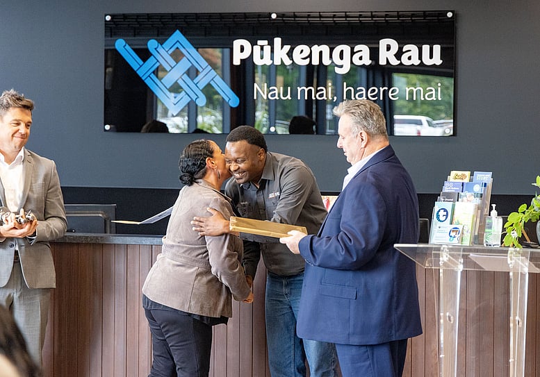 A recipient is presented with her scholarship certificate at Pūkenga Rau.