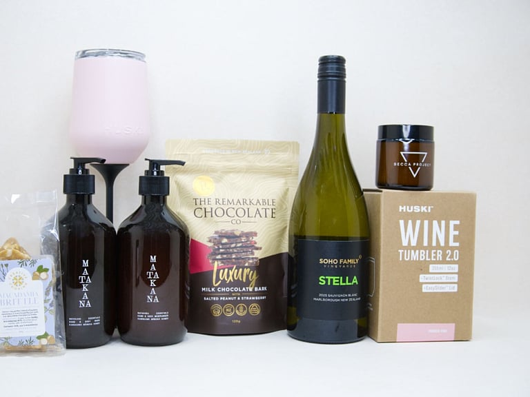 Thank You Gift Box featuring Stella Sauvignon Blanc, a HUSKI wine tumbler, Matakana Botanicals moisturiser and body wash, Remarkable strawberry luxury bark, and macadamia brittle, beautifully packaged to show appreciation and gratitude.