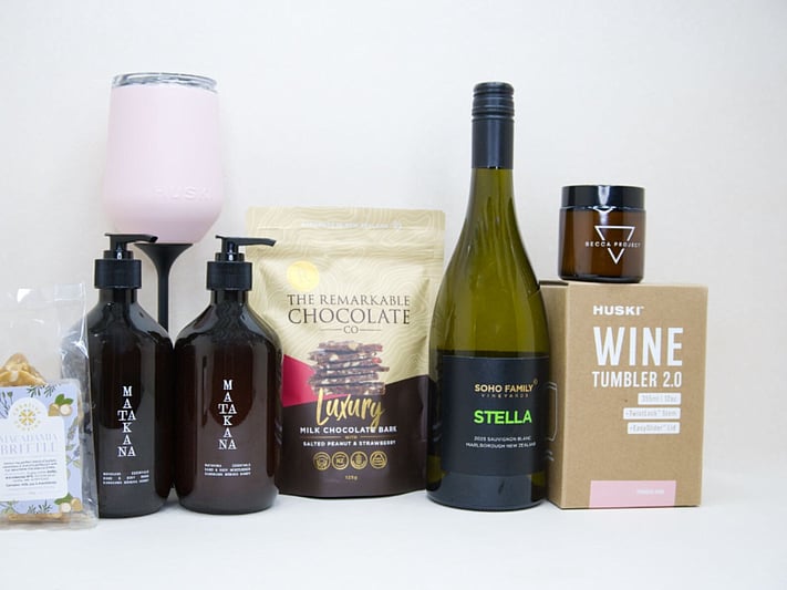Thank You Gift Box featuring Stella Sauvignon Blanc, a HUSKI wine tumbler, Matakana Botanicals moisturiser and body wash, Remarkable strawberry luxury bark, and macadamia brittle, beautifully packaged to show appreciation and gratitude.