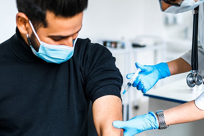 A pharmacist preparing a travel vaccination at a Christchurch travel clinic
