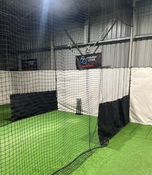 Indoor cricket practice lanes fitted with white netting