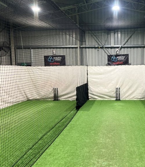Black ripstop canvas buffer sheet fitted within a cricket practice lane