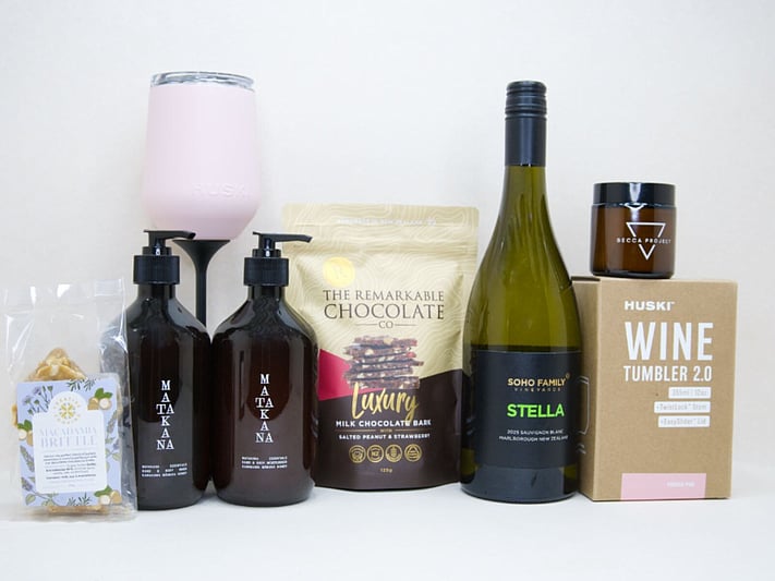 Thank You Gift Box featuring Stella Sauvignon Blanc, a HUSKI wine tumbler, Matakana Botanicals moisturiser and body wash, Remarkable strawberry luxury bark, and macadamia brittle, beautifully packaged to show appreciation and gratitude.
