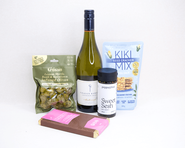 Wine & Crackers Gift Box featuring Craggy Range Sauvignon Blanc, artisan olives, Kiki Seed Crackers, Pepper & Me Hot Honey, and Remarkable Raspberry Marshmallow Chocolate, beautifully packaged for wine lovers and gourmet gifting.