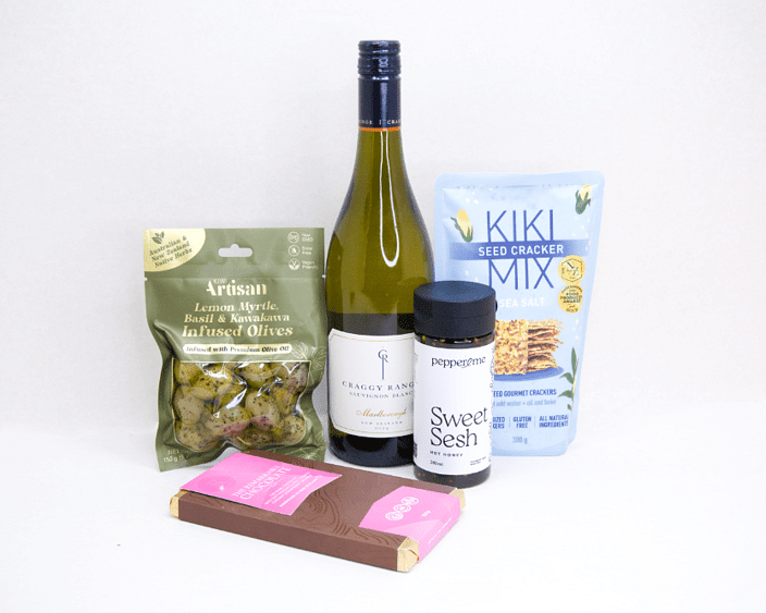 Wine & Crackers Gift Box featuring Craggy Range Sauvignon Blanc, artisan olives, Kiki Seed Crackers, Pepper & Me Hot Honey, and Remarkable Raspberry Marshmallow Chocolate, beautifully packaged for wine lovers and gourmet gifting.