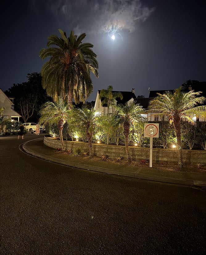 The premium Russell Cottages resort complex captured at night under a spectacular all but full moon near Crab Shack Cottage