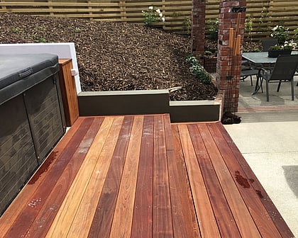 Deck connecting a Nelson home with the surrounding garden