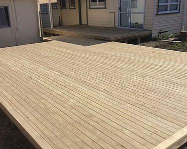 large treated timber pine deck connecting home in Nelson