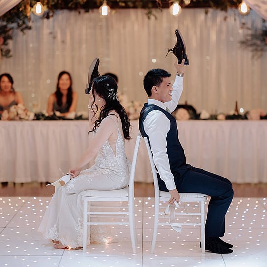 wedding couple playing shoe games