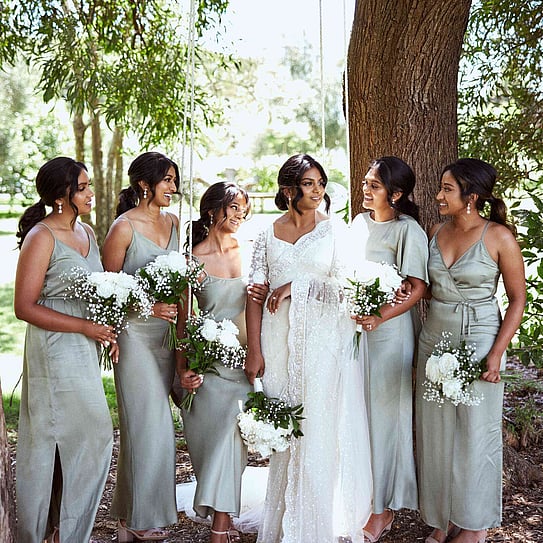 Bride and bridesmaid posing