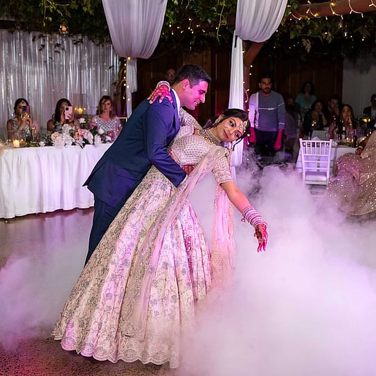 Indian bride & groom dancing 