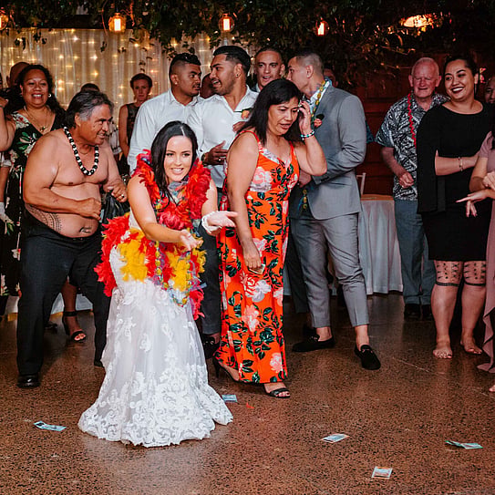 bride and wedding guests playing game